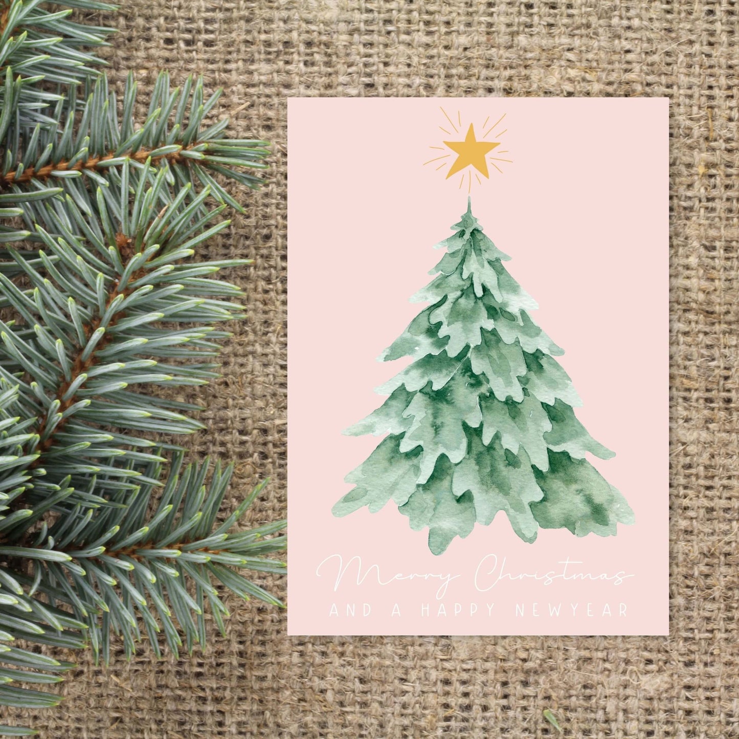 roze kerstkaart met kerstboom merry christmas and a happy new year