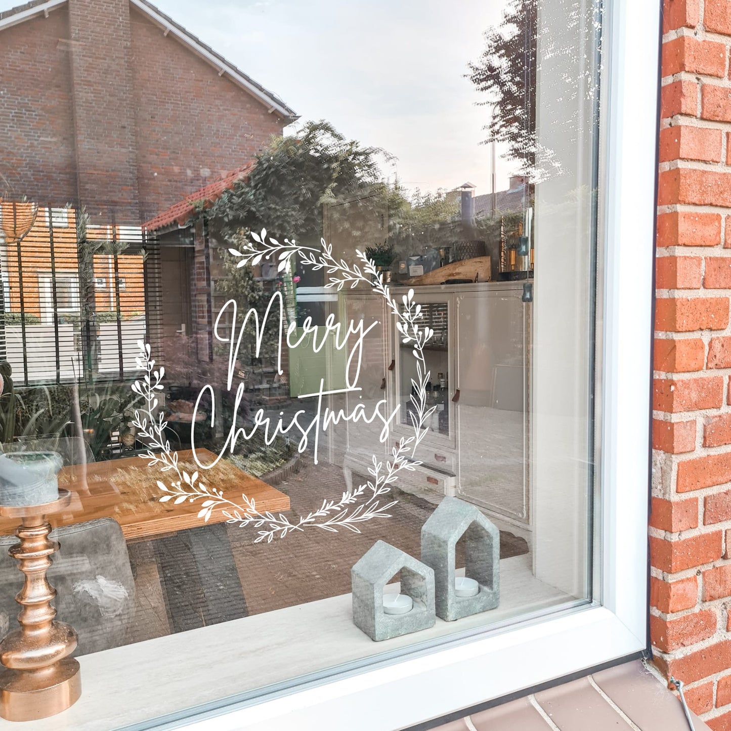 raamsticker half open van bladeren met merry christmas