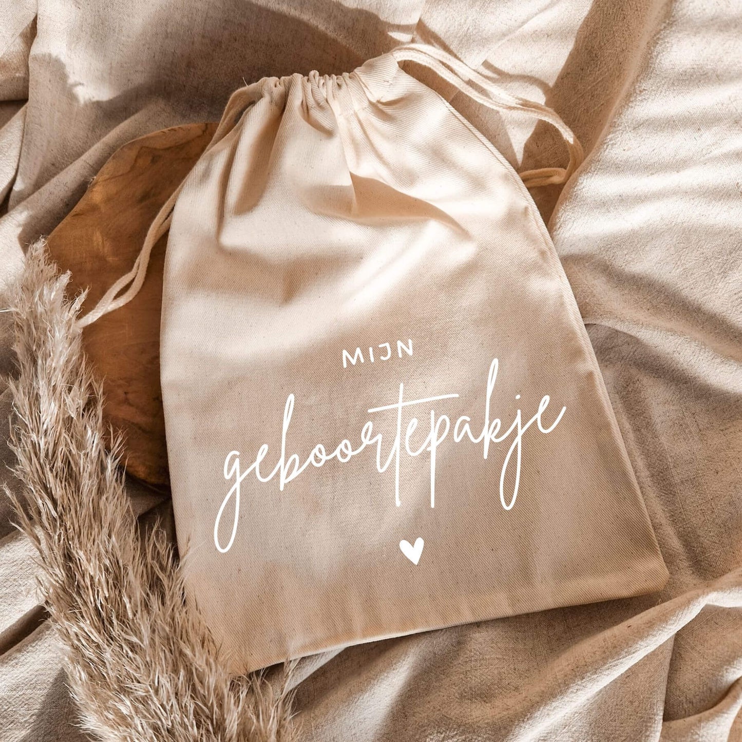 geboortepakje bewaren in een bewaarzak wit